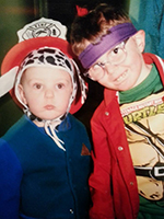 Dressed as the Ninja Turtles' techie, Donatello, with my brother during Halloween in the early 90s. The holiday, costuming, & nerd culture would continue to be an important part of my life.